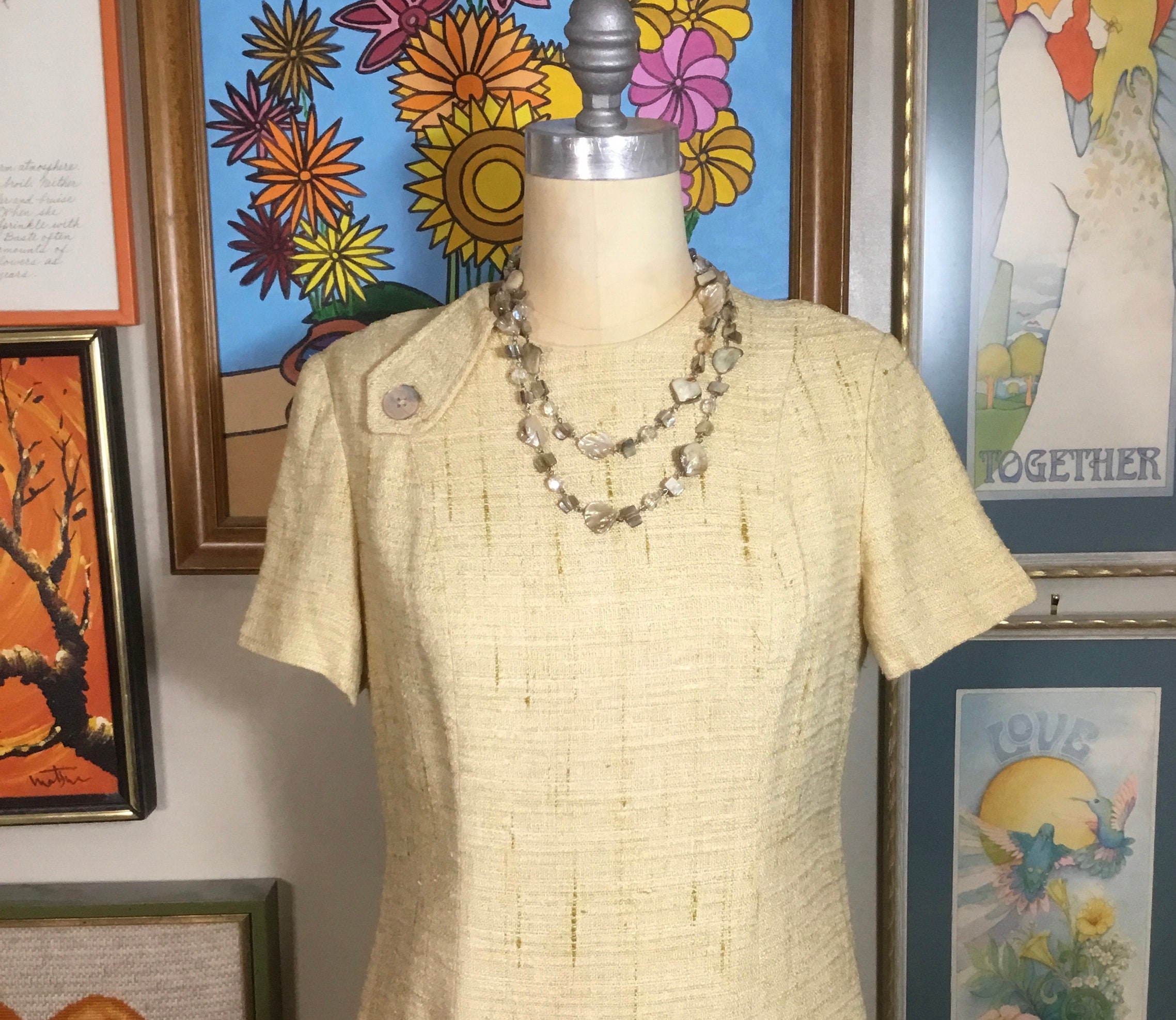 60s -70s Jewelry – Necklaces, Earrings, Rings, Bracelets Vera Maxwell Original 1960s Beige Flax Dress $95.00 AT vintagedancer.com