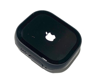 May include: A black Apple Watch with a white Apple logo on the screen.