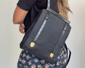 black versace mini backpack Nylon & Black Goatskin Gold Studded Palazzo Medusa | myGemma this bag is adorned with the brands signature Medusa hardware Vintage 1990s VERSACE PROFUMI Black