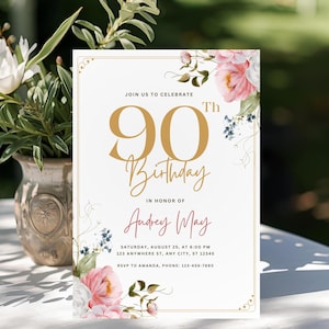 May include: A floral 90th birthday invitation with gold text and pink and white flowers. The invitation reads "Join us to celebrate 90th Birthday in honour of Audrey May". Includes event details and RSVP information. A vase of flowers sits to the left.