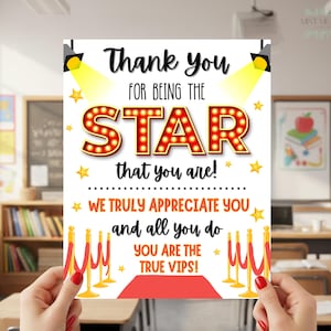 May include: A thank you card with the text "Thank You For Being The STAR that you are!" in a theater marquee style. The card also says "We truly appreciate you and all you do. You are the true VIPs!" with a red carpet design.