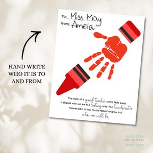 May include: A white card with a red crayon design made from a handprint. The card is addressed to "Miss May" from "Amelia." Text on the card reads "The mark of a good teacher won't fade away." The card is a teacher appreciation gift.