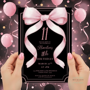 May include: Black birthday invitation with a pink bow and ribbon design. The invitation reads "11" and "Amelia's 11th Birthday". Pink balloons and confetti are in the background. The invitation is held by a person.