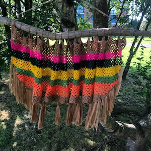 multicolored striped crochet and macrame tapestry