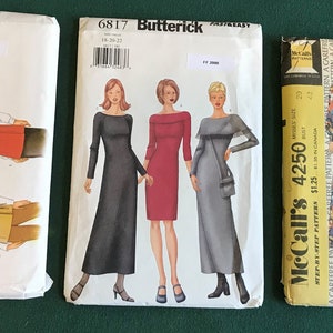May include: Three sewing patterns for women's clothing. The patterns are from Butterick and McCall's. The Butterick patterns are for a vest, jacket, and dress. The McCall's pattern is for a dress, top, jacket, and pants.
