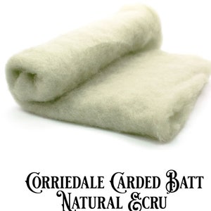 May include: A close-up of a light beige Corriedale carded batt, a natural fiber used for felting and spinning. The batt is rolled up and has a soft, fluffy texture. The text "Corriedale Carded Batt Natural Ecru" is printed below the batt.