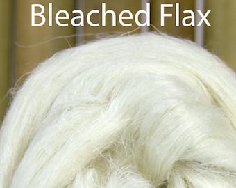 May include: Close-up of bleached flax fibers, a natural fiber used in textiles and other products. The fibers are white and fluffy, and they have a soft, silky texture.