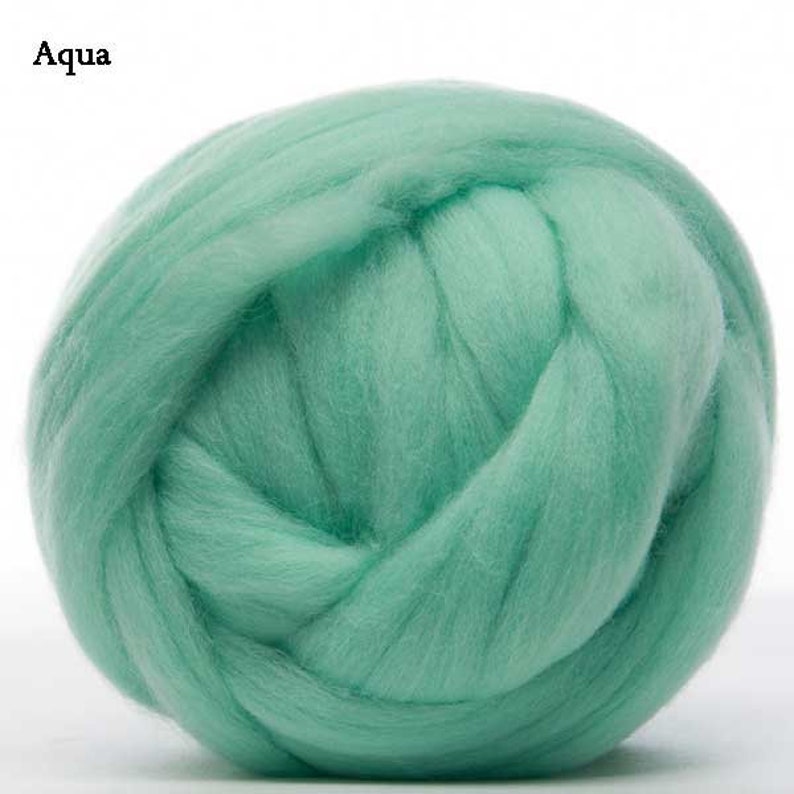 May include: A ball of aqua blue wool roving. This is a type of wool fiber used for felting and spinning.
