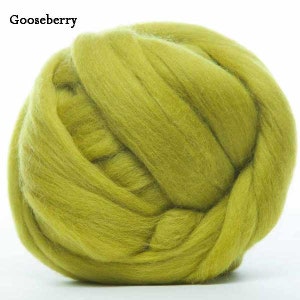 May include: A ball of light green wool roving. The wool is soft and fluffy, and it is perfect for felting or spinning.