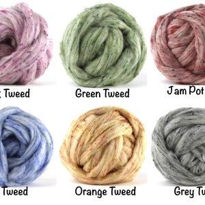 May include: Six balls of yarn in different colors, including pink, green, red, blue, orange, and gray. Each ball has a speckled pattern and is labeled with the color and the word "Tweed".