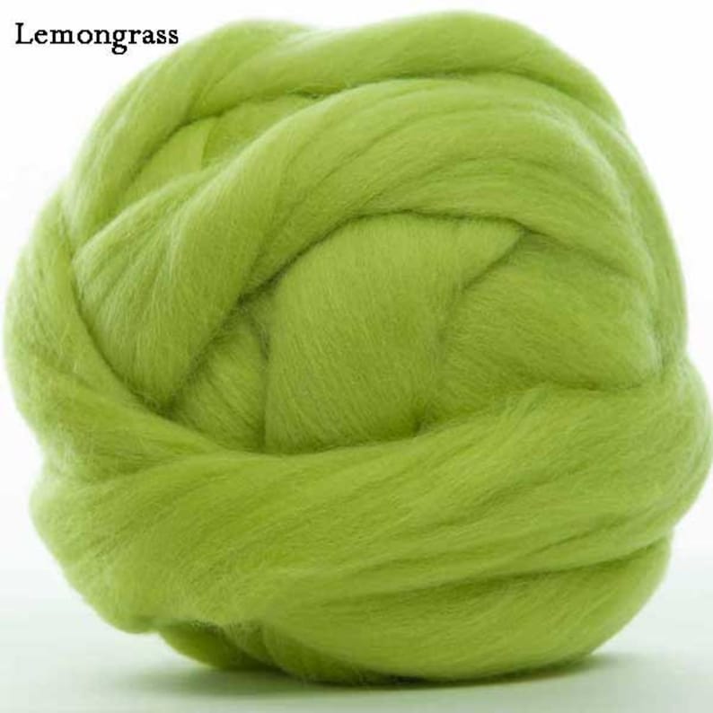 May include: A large ball of light green wool roving, perfect for felting or spinning.