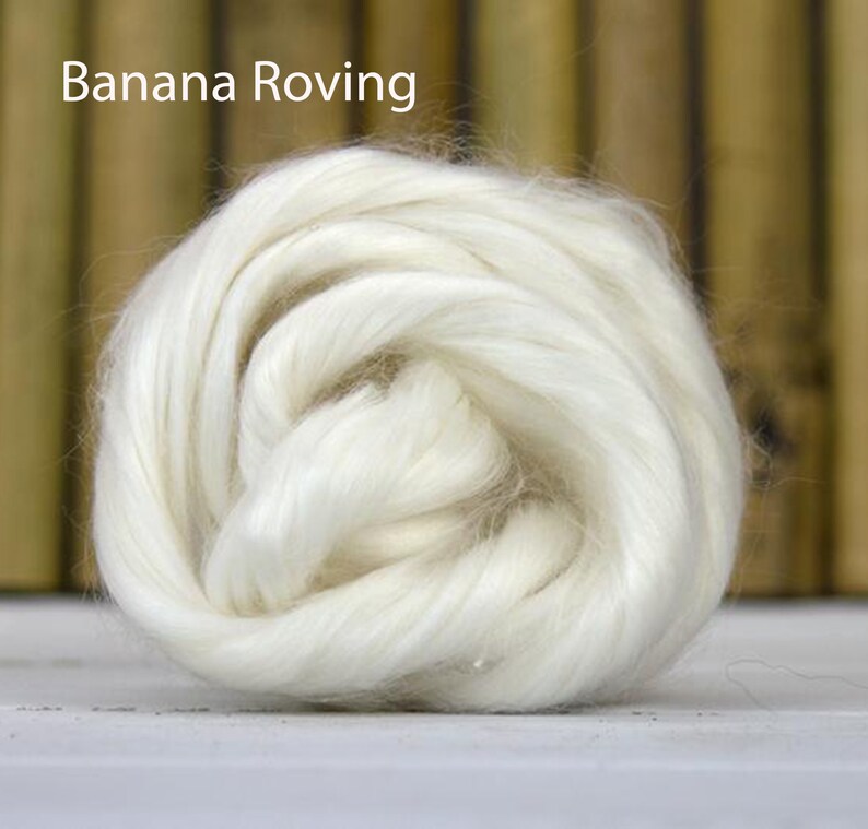 May include: A close-up of a white, fluffy, natural fibre roving, called "Banana Roving".