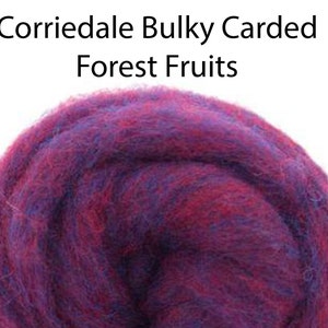 May include: A close-up of a Corriedale Bulky Carded Forest Fruits wool roving. The roving is a blend of deep purple and red colors.