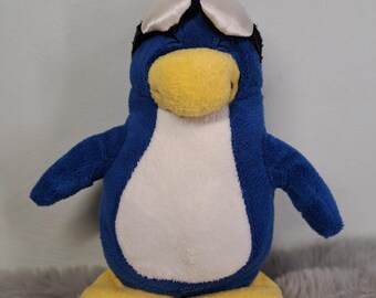 Peluche vintage Disney Club Penguin bleue avec lunettes 18 cm JAKKS Pacific Mix n Match