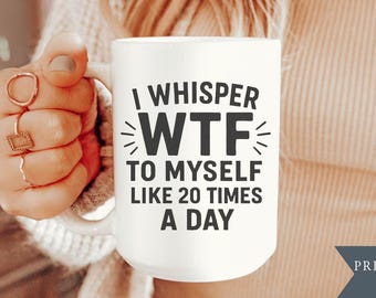 May include: A white ceramic mug featuring the black text I WHISPER WTF TO MYSELF LIKE 20 TIMES A DAY. The mug is available in 11 or 15 oz sizes as indicated by the text in the upper left corner. The design is printed and shipped in the USA.