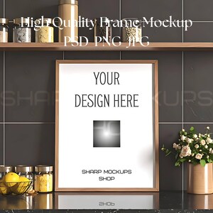 May include: A wooden framed mockup with the text "YOUR DESIGN HERE" on a white background. The mockup is set against a dark tiled wall with a shelf above and a countertop below. The text "SHARP MOCKUPS SHOP" is at the bottom.
