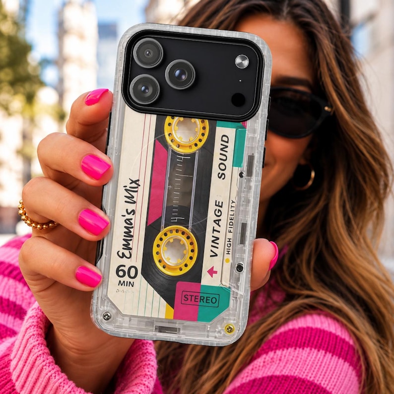 May include: A clear protective phone case featuring a graphic design of a vintage cassette tape. The design includes yellow reels, pink and teal accents, and text that reads Emma's Mix, 60 MIN, VINTAGE SOUND, HIGH FIDELITY, and STEREO.