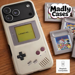 Personalized retro game boy console phone case with MagSafe on a wooden table, vintage handheld gaming design inspired by 80s 90s game and boy style, compatible with iPhone, Samsung and Pixel