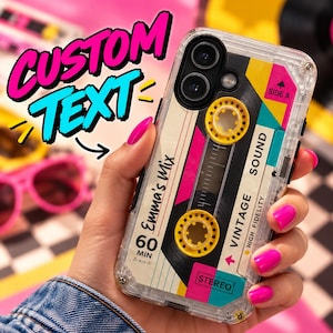 May include: A clear phone case featuring a retro cassette tape design with yellow reels, pink and teal accents, and text that reads Emma's mix, 60 MIN, SIDE A, VINTAGE SOUND, HIGH FIDELITY, and STEREO. The case has a transparent frame and camera cutout.