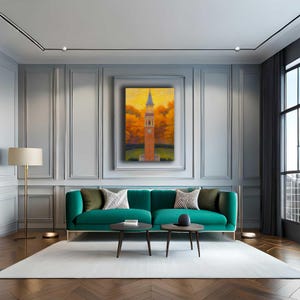 May include: An interior design scene featuring a teal sofa, two small round coffee tables, and a framed painting of a clock tower. The painting has a warm color palette with orange and yellow hues. The room has a modern aesthetic with a neutral color scheme.