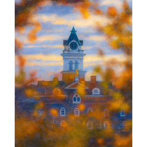 May include: An impressionistic painting of a building with a clock tower, framed by autumn foliage. The tower is white with a dark green roof and a clock face. The building has a red roof and arched windows.