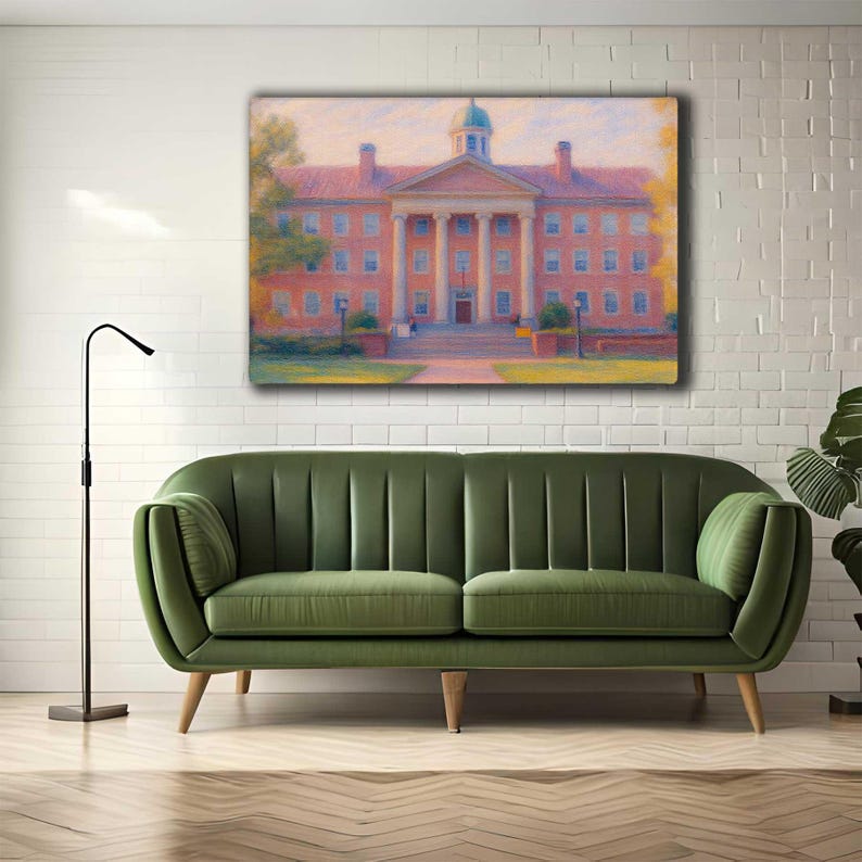 May include: A framed canvas print of a building with a red brick facade, white columns, and a green dome. The artwork is displayed above a green velvet sofa. A black floor lamp stands to the left.