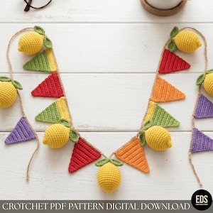 May include: A crochet garland with yellow lemons and colourful triangular flags in red, orange, green, and purple. The garland is strung on natural twine, creating a cheerful, handmade decoration. The text at the bottom reads "CROCHET PDF PATTERN DIGITAL DOWNLOAD."