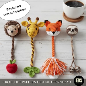 以下が含まれることがあります： かぎ針編みの動物のブックマーク。画像には、ライオン、キリン、キツネ、ナマケモノの4つの手作りのかぎ針編みのブックマークが表示されています。ライオンは茶色のたてがみと赤いリンゴを持っています。キリンは黄色の斑点と緑の葉を持っています。キツネはオレンジ色の毛皮と白とオレンジ色のフリンジを持っています。ナマケモノは笑顔の顔をしています。