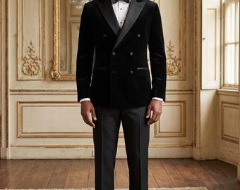 May include: A black velvet double-breasted blazer with satin lapels, worn with black trousers, a white dress shirt, and a black bow tie. The outfit is finished with black dress shoes. This ensemble is suitable for formal occasions.