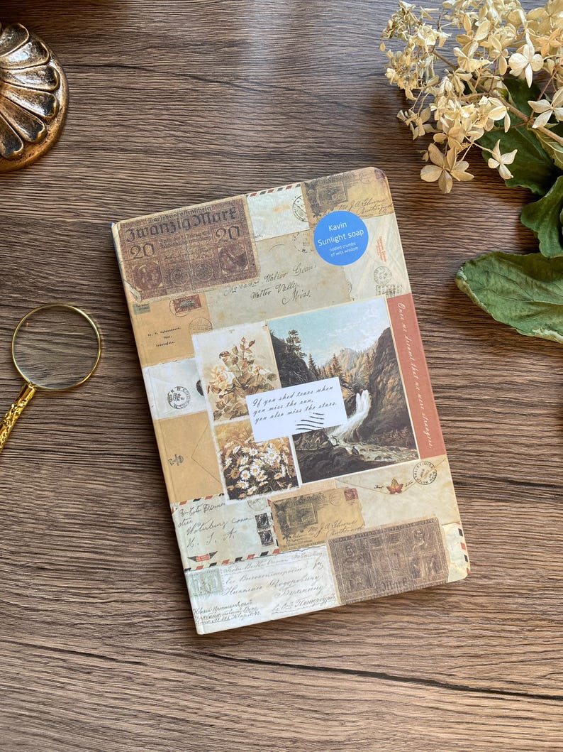 May include: A vintage-style journal with a collage of old stamps, postcards, and handwritten letters. The cover features a scenic waterfall image and the text "If you shed tears when you miss the sun, you also miss the stars."