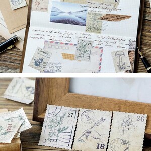 May include: Vintage-style postage stamps with botanical and artistic designs. The stamps feature numbers, illustrations, and text, including "Catmint" and "Pour Nettoyer". The stamps are arranged on a journal page and a wooden frame.