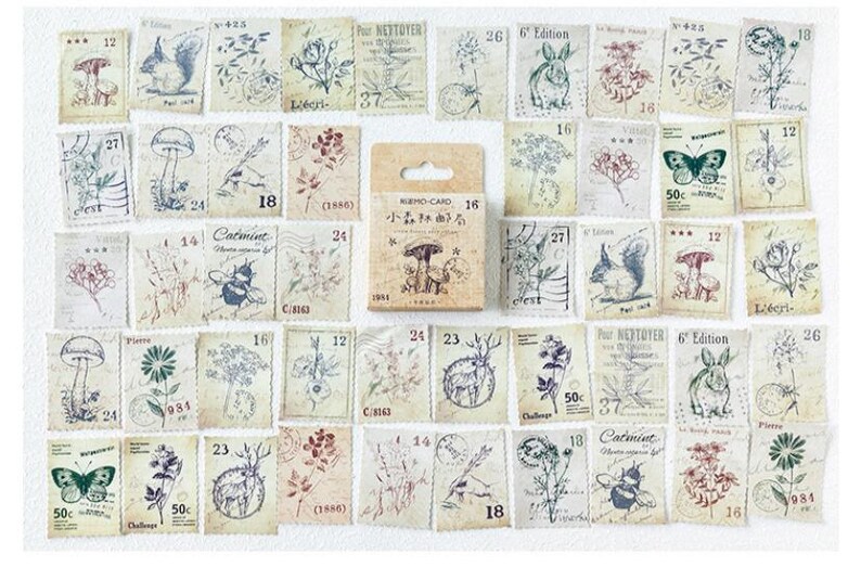 May include: A collection of vintage-style paper stamps with botanical and animal illustrations. The stamps feature images of mushrooms, butterflies, squirrels, and flowers in muted colors. A small box of stamps is in the center.