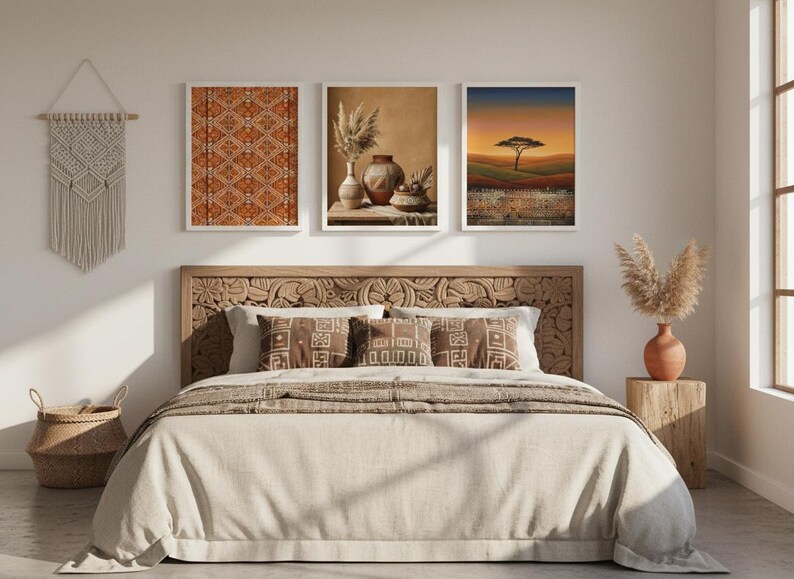 Three African-inspired art prints in gold frames above a boho bedroom headboard, featuring a warm earth-tone geometric textile, an elegant African queen portrait, and a golden savanna sunset landscape with tribal border details