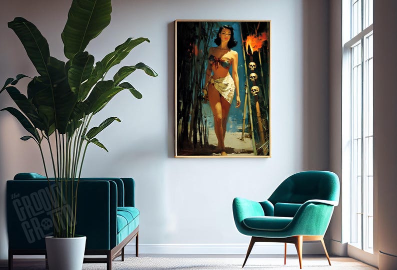 May include: A framed print of a vintage-style illustration of a woman in a bikini walking on a beach. The artwork has a gold frame and is displayed on a white wall. The room also features a teal sofa, chair, and a large potted plant.