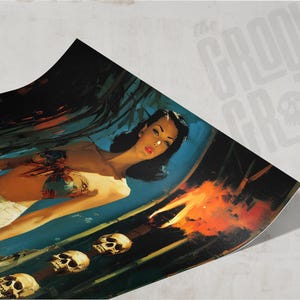 May include: A vintage-style print featuring a woman in a tropical setting with skulls and fire. The artwork has a retro aesthetic with a dark blue and orange color palette. The Groovy Grotto logo is visible in the background.