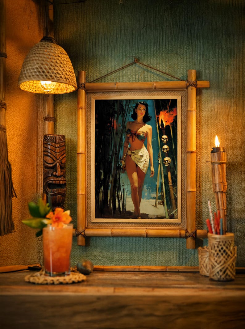 May include: A framed print of a woman in a tropical setting, framed with bamboo. The image is part of a tiki bar scene, with a woven lamp, a tiki mask, a cocktail, and a lit torch. The color palette is warm, with oranges, browns, and greens.