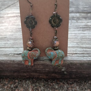Czech glass beaded green flower and elephant dangle earrings