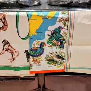 May include: A set of three ceramic mugs with a speckled, matte finish. The mugs are in shades of cream, light gray, and dark gray. Each mug has a simple, minimalist design, perfect for coffee or tea.