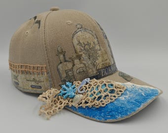 By the snap side, custom designed snap back hat.