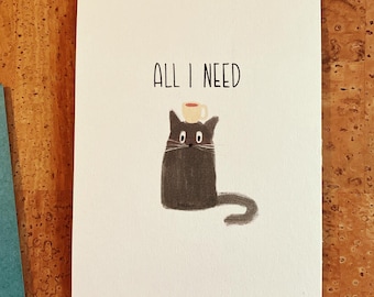 Può includere: Biglietto bianco con illustrazione di un gatto nero e la scritta "ALL I NEED". Il gatto ha una piccola tazza di caffè in equilibrio sulla testa. L'opera è semplice e stravagante.
