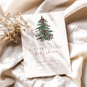 May include: A baby shower invitation with a Christmas theme. The invitation features a green Christmas tree decorated with red bows and snowflakes. The text reads "A Merry Little Baby Shower".