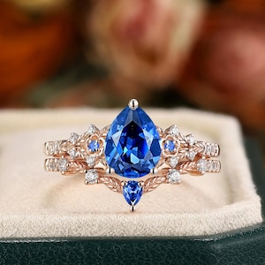 Pear Cornflower Blue Sapphire Engagement Ring Set: Rose Gold Floral Wedding