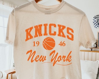 ヴィンテージ ニューヨーク・ニックス Tシャツ：1990年代 NBA
