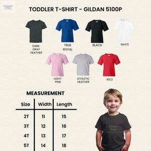 May include: A range of toddler t-shirts in colours such as dark grey, true royal, black, white, light pink, athletic heather, and red. The image includes a size chart with measurements in inches, and a child wearing a dark grey t-shirt.