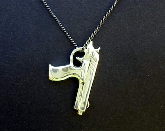 gun jewelry pistol necklace gun pendant reverse pistol pendant peace sign sterling silver hand carved peace sign.
