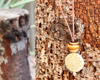 Beaded adjustable necklace with carved wood flower bead