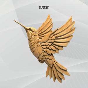 May include: A detailed wooden hummingbird sculpture in flight, with outstretched wings and a long beak. The bird is carved from light-colored wood, showcasing intricate feather details. The text "STLPROJECT" is at the top.