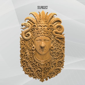 May include: A detailed, golden-colored relief carving of a face with an elaborate headdress and ornate, swirling patterns. Two snakes flank the face. The text "STLPROJECT" is at the top.
