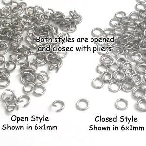 May include: A close-up image of two piles of silver jump rings. The jump rings are 6mm in diameter and 1mm in thickness. The jump rings on the left are open, while the jump rings on the right are closed. The text "Both styles are opened and closed with pliers" is written in the center of the image. The text "Open Style Shown in 6x1mm" is written below the left pile of jump rings. The text "Closed Style Shown in 6x1mm" is written below the right pile of jump rings.