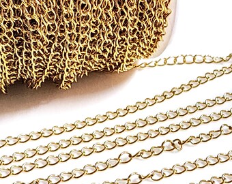 May include: A close-up of a gold chain, showing the individual links. The chain is coiled up on a spool, with a few strands extending out.